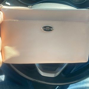 Pink coach clutch